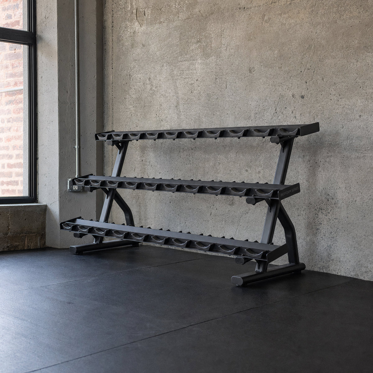 Centr x HYROX 15-pair dumbbell rack in a gym