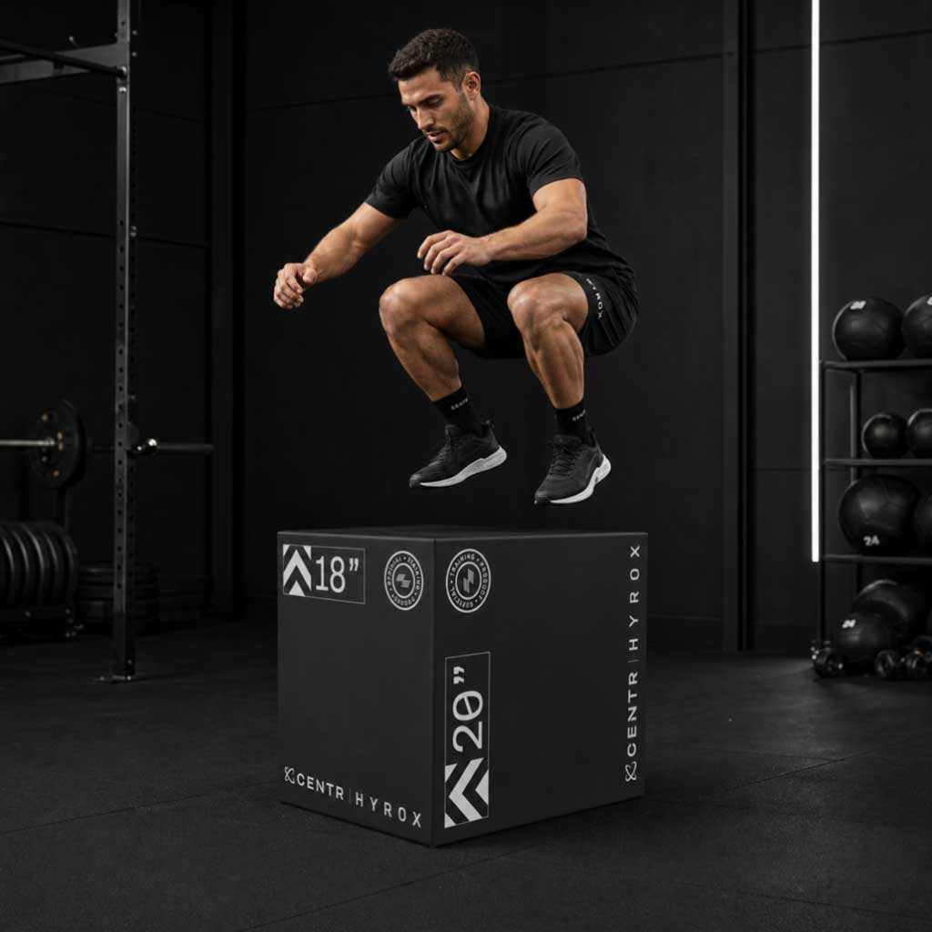 Athlete jumping onto the compact Centr x HYROX foam plyo box