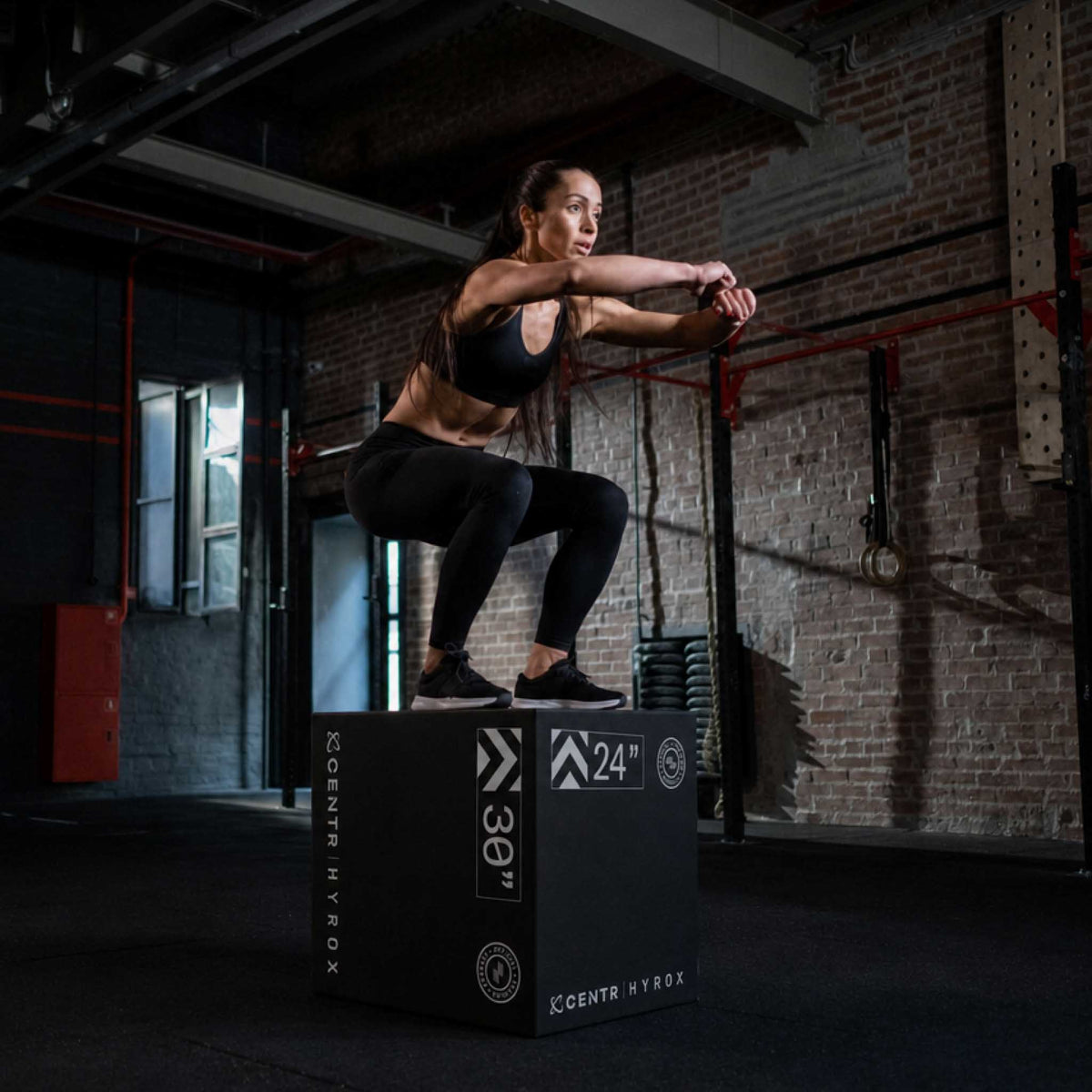 Athlete jumping onto the large Centr x HYROX foam plyo box